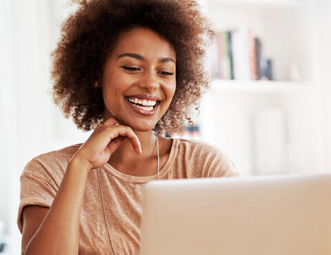 Woman smiling at screen